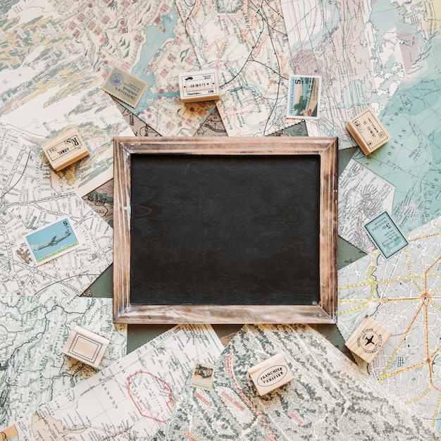 Blackboard and stamps on table