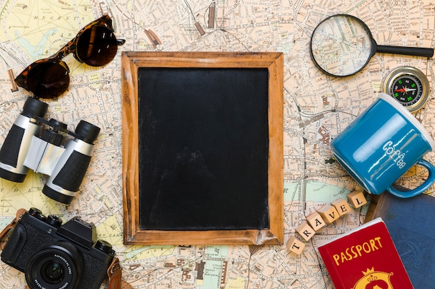 Blackboard surrounded by travel elements