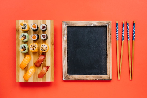 Blackboard between sushi and chopsticks