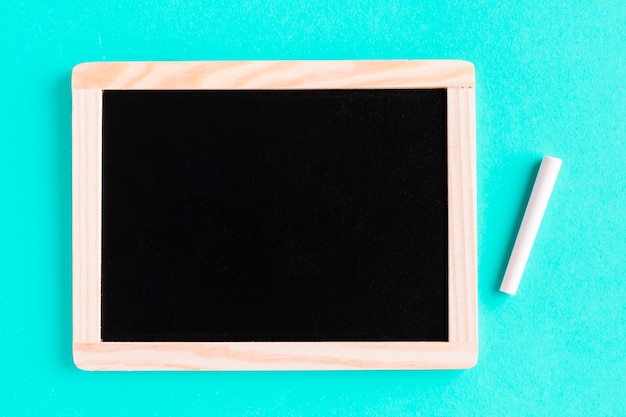 Blackboard with chalk on colored surface