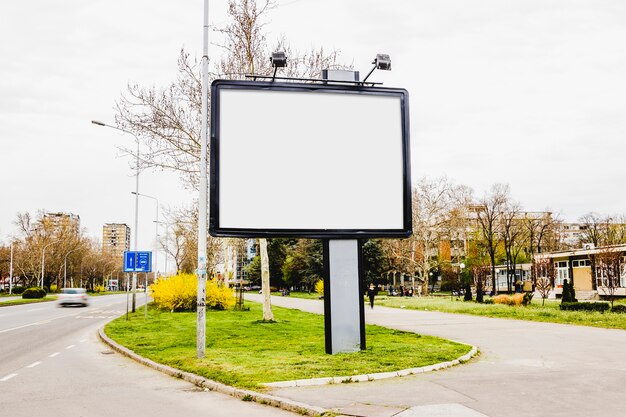 Blank adverting billboard in the center of the road
