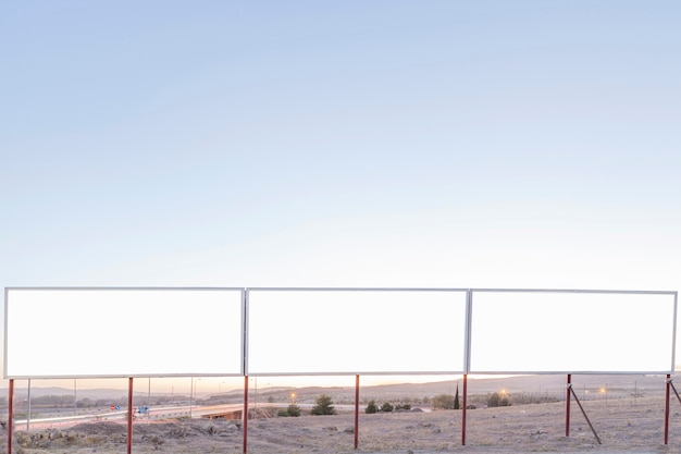 Free Photo blank advertising billboards near the highway against blue sky