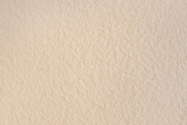 Free photo blank beige textured wallpaper background