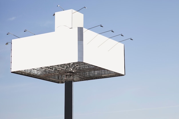 Blank billboard ready for new advertisement against blue sky