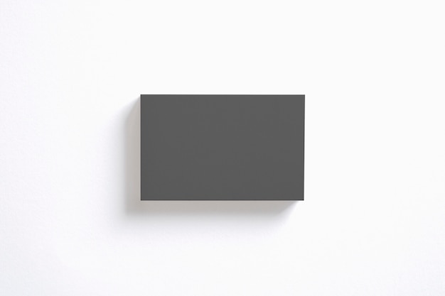 Blank black business cards stack isolated on white. Clear template to showcase your presentation.