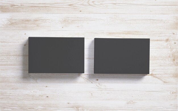 Blank black business cards on wooden desk background