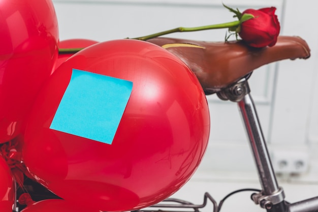 Blank blue sticker on balloon fixed to cycle