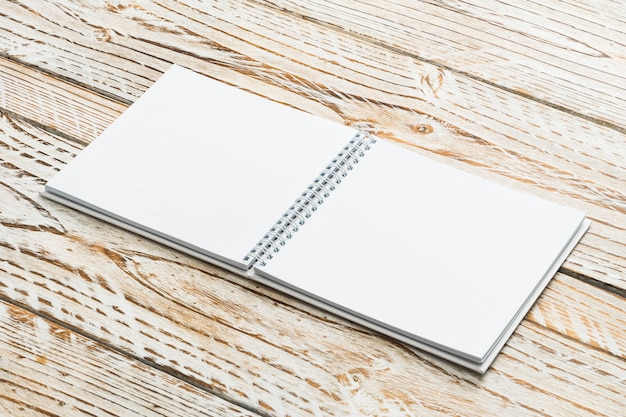 Blank book mock up on wooden background