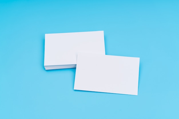 Free photo blank business card on blue background .