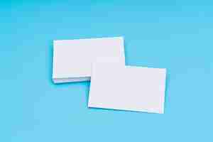 Free photo blank business card on blue background .