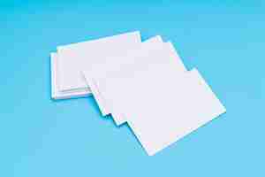 Free photo blank business card on blue background .