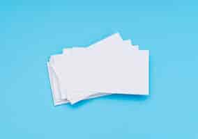 Free photo blank business card on blue background .