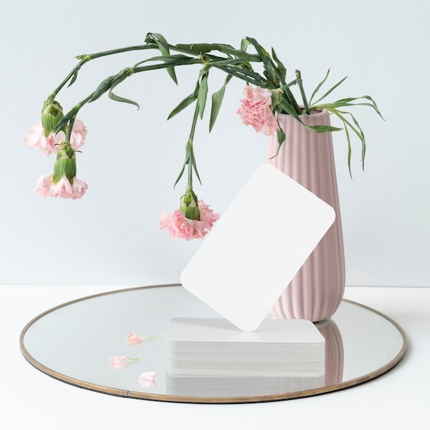Free photo blank business card and flower vase