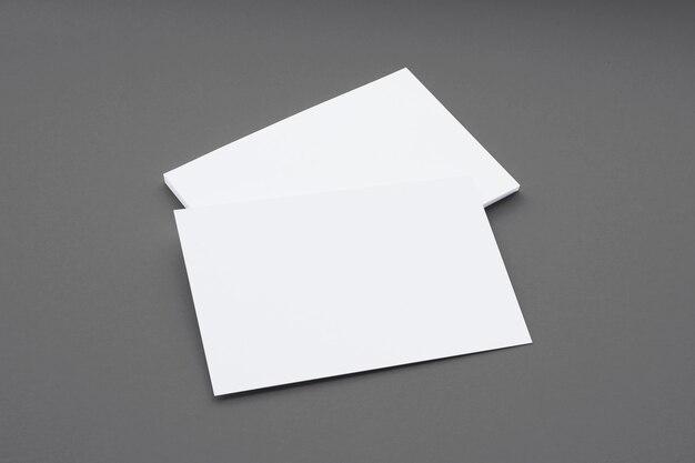 Blank business cards composition isolated on grey