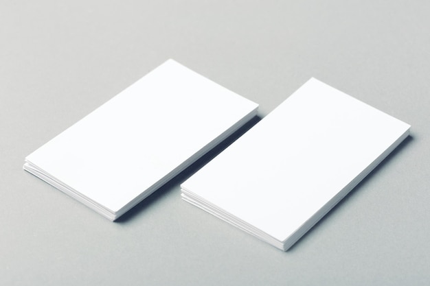 Blank business cards on grey background