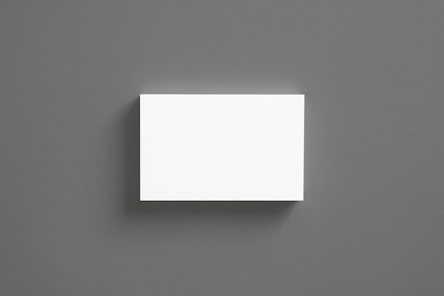 Free photo blank business cards stack isolated on grey top view