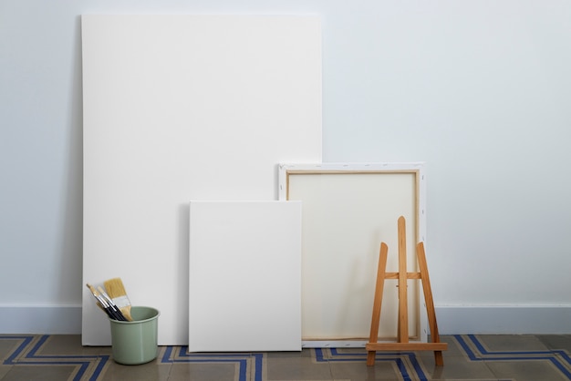 Free photo blank canvas for painting indoors still life