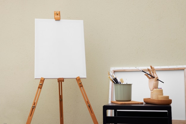 Free photo blank canvas for painting indoors still life