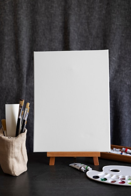 Free photo blank canvas for painting indoors still life