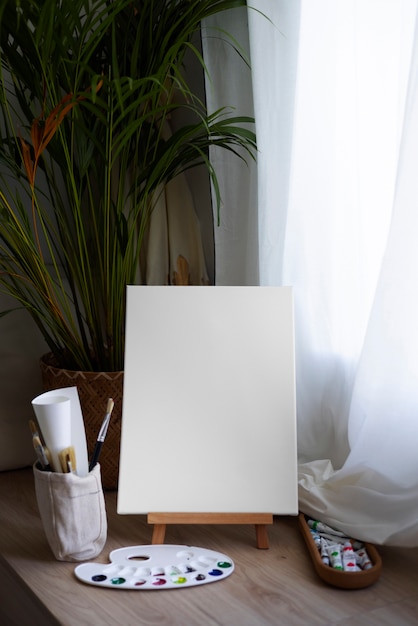 Free photo blank canvas for painting indoors still life