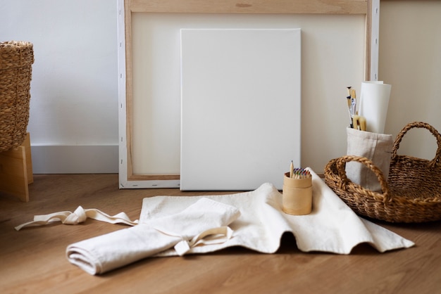 Free photo blank canvas for painting indoors still life