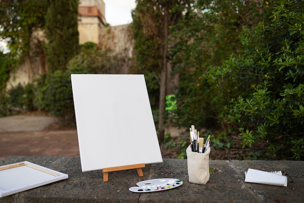 Free photo blank canvas for painting outdoors still life