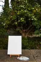 Free photo blank canvas for painting outdoors still life