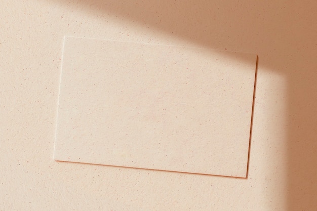 Free photo blank card on a beige concrete