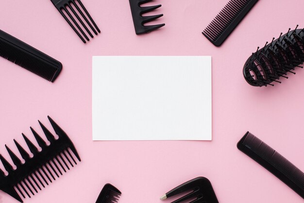Blank card surrounded by hairdressing tools
