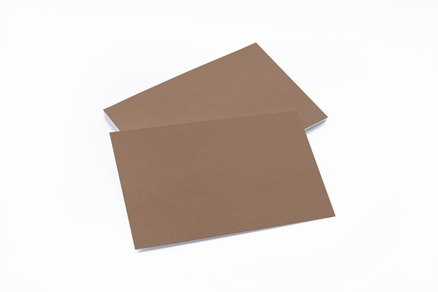 Blank cardboard business cards isolated on white