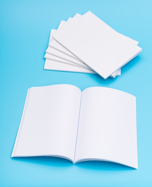 Free photo blank catalog, magazines,book mock up on blue background. .