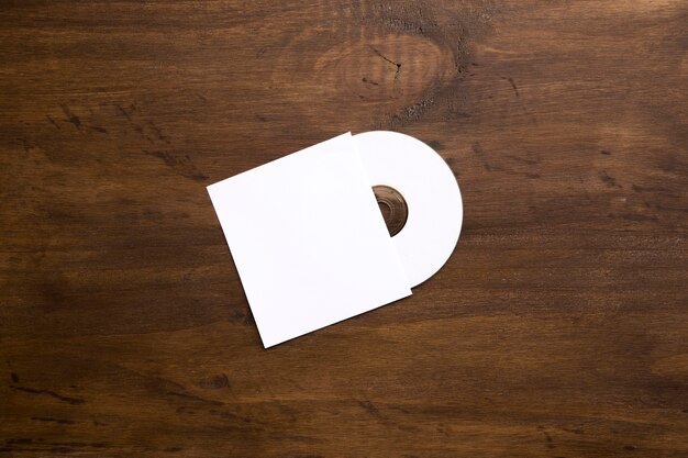 Blank cd mockup on wooden texture