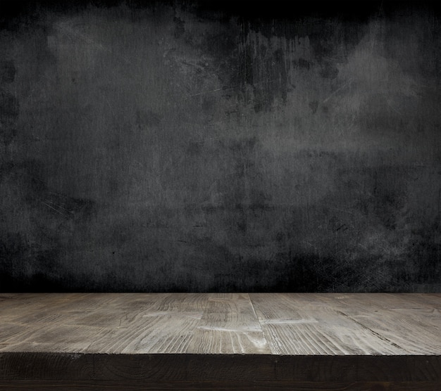 Blank cleaned chalkboard with wooden background