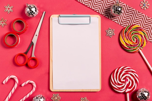 Blank clipboard with candy canes