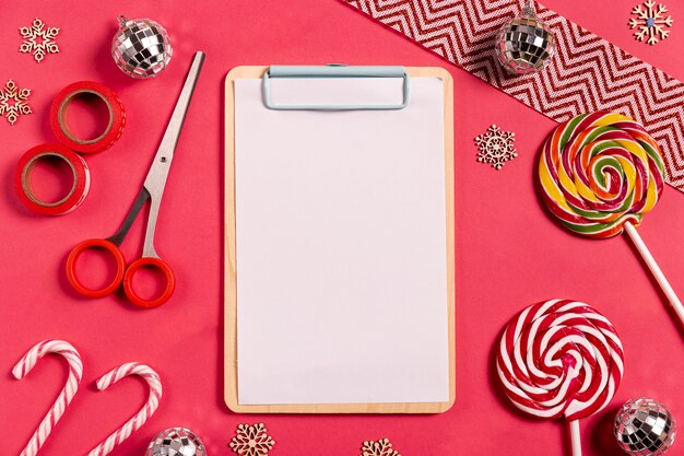 Blank clipboard with candy canes