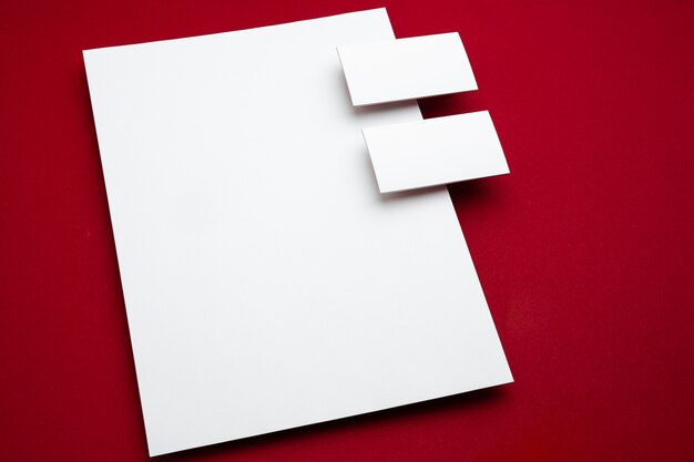 Blank flyer poster isolated on red to replace your design.