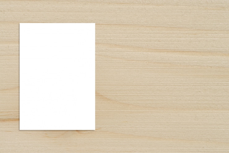 Free Photo blank folded paper poster hanging on wooden wall,template mockup for adding your design.
