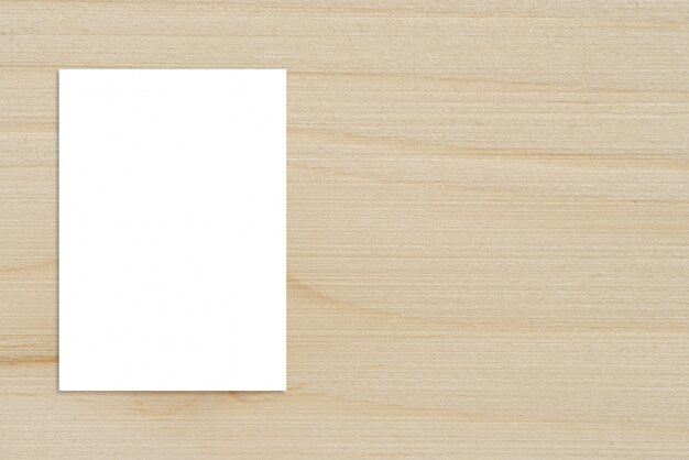 Blank folded paper poster hanging on wooden wall,Template mockup for adding your design.