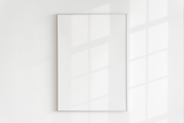 Free photo blank frame on a wall with natural light