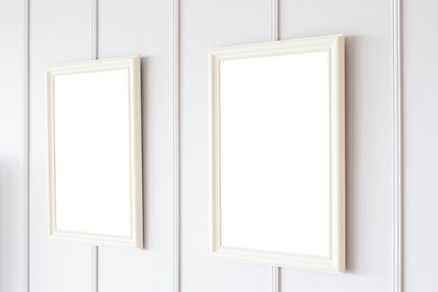 Blank frame on white wall background