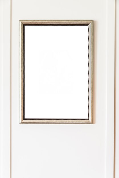 Blank frame on white wall background