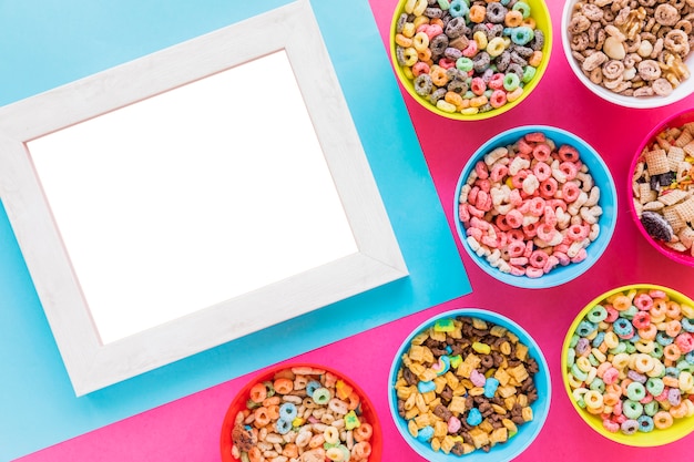 Free photo blank frame with bowls of cereals