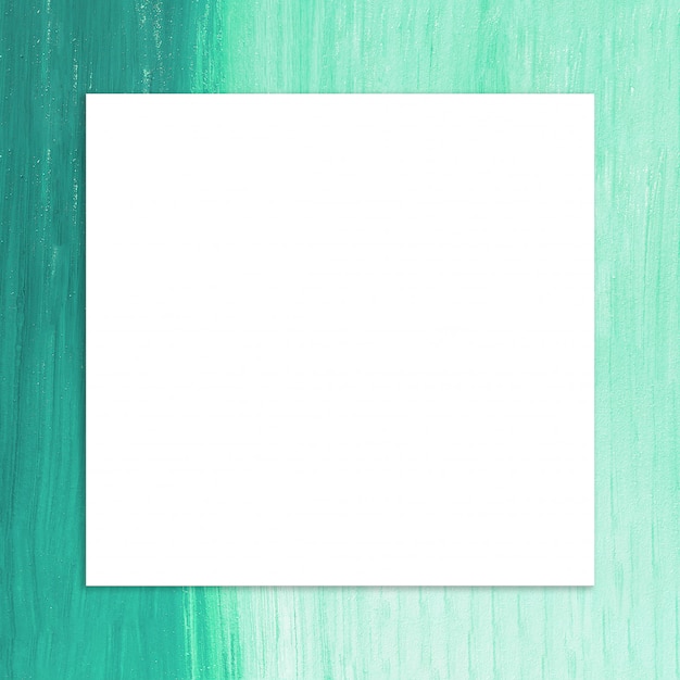 Free photo blank frame with brush of green paint background