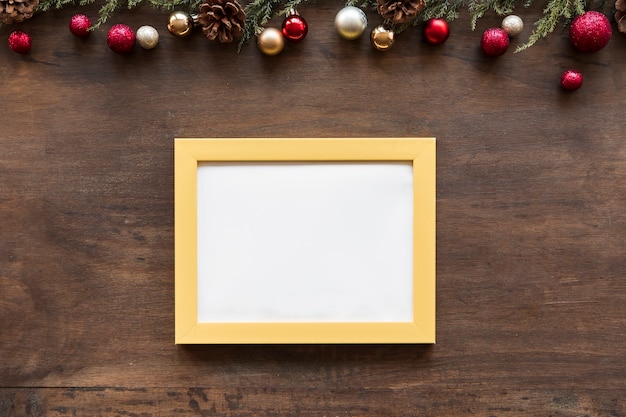 Free photo blank frame with small shiny baubles