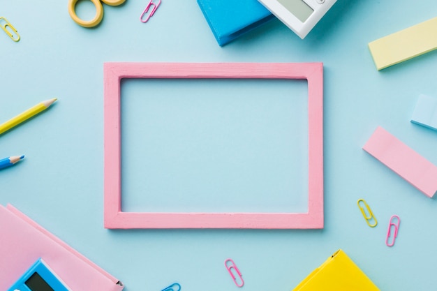 Free photo blank frame with stationery