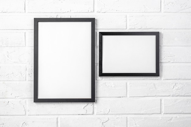 Blank frames on white wall