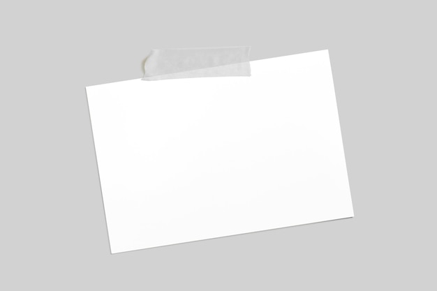 Blank horizontal photo frame with scotch tape isolated on grey paper background 