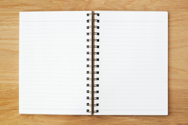 Blank lined notebook on a wooden table