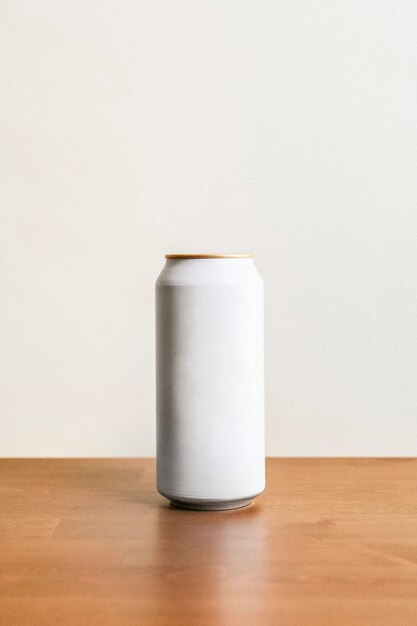 Blank minimal white tin can on wooden floor