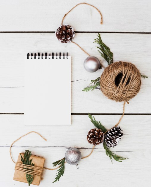 Blank notebook with Christmas decorations around